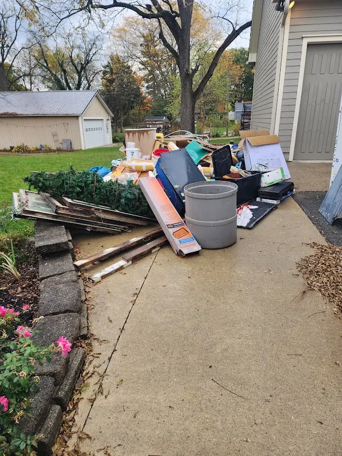 Dumpster being loaded with debris for Commercial Dumpster Rental in West Lampeter